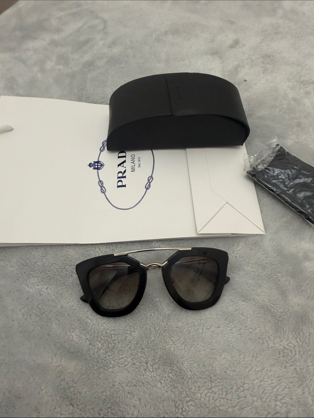 Prada Black Frame Sunglasses with Gray Lenses